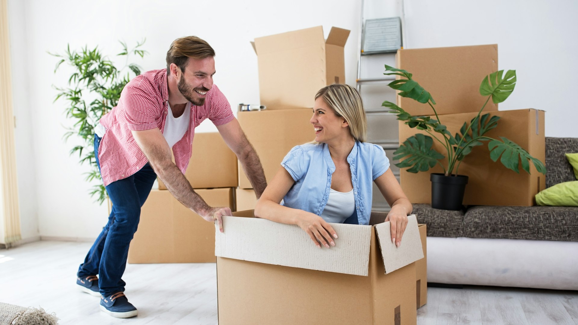 Excited couple move into their new rented property